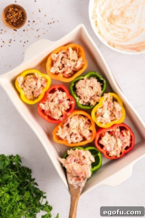 Savory Chicken Stuffed Bell Peppers 14 Chicken mixture in peppers in a baking dish.