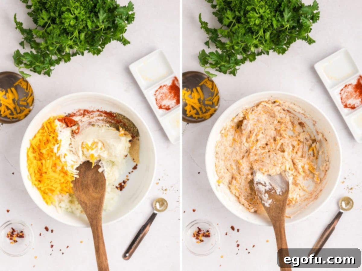 Savory Chicken Stuffed Bell Peppers 7 A bowl with shredded cheddar cheese, cream cheese, onion, paprika, Italian seasoning, garlic powder, onion powder, black pepper, salt, and red pepper flakes mixed together.