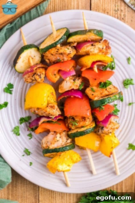 Looking down on a plate of Baked Chicken Skewers.