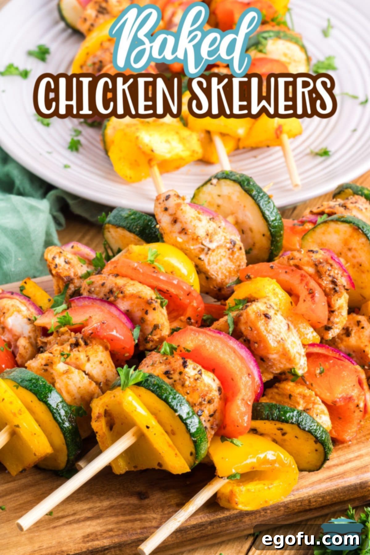 A few Baked Chicken Skewers on a cutting board, ready to be served.