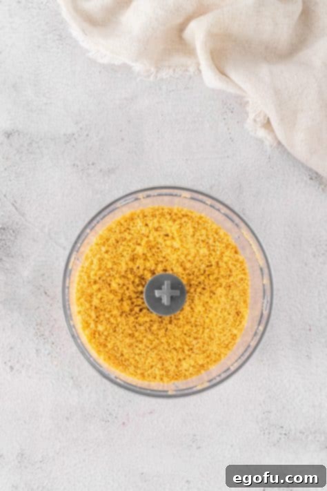 Lemon Oreo crumbs in a food processor.