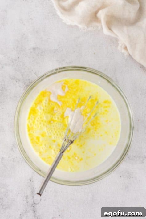 Lemon pudding being mixed together.