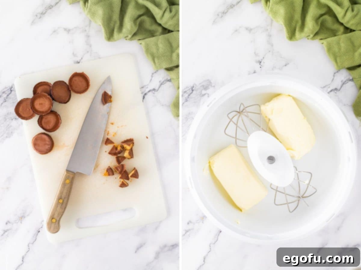Reese's cups being chopped on a cutting board with a knife and a mixing bowl with cream cheese.