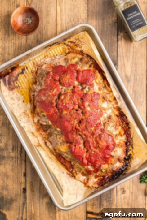 Grandma's Secret Italian Meatloaf 15 Baked meatloaf on a baking sheet.