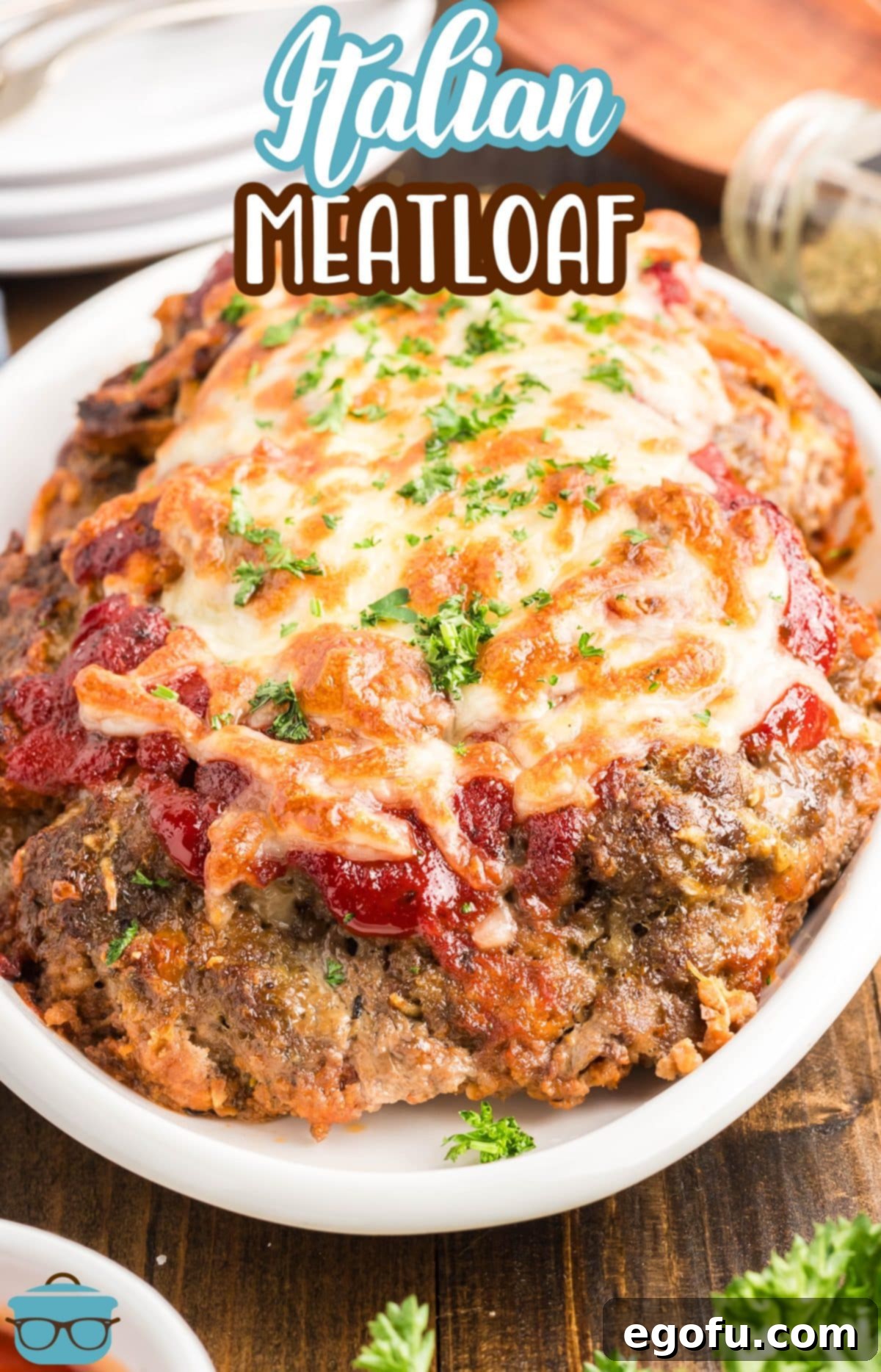 Grandma's Secret Italian Meatloaf 3 A large, perfectly baked Italian Meatloaf presented on a serving platter, glistening with marinara and melted cheese.