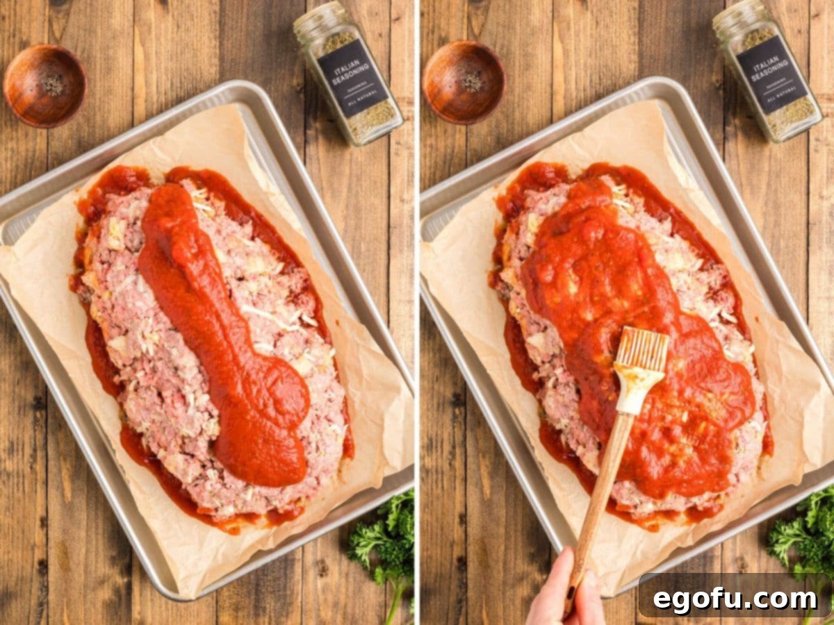 Grandma's Secret Italian Meatloaf 7 Marinara sauce being spread over the unbaked Italian Meatloaf.