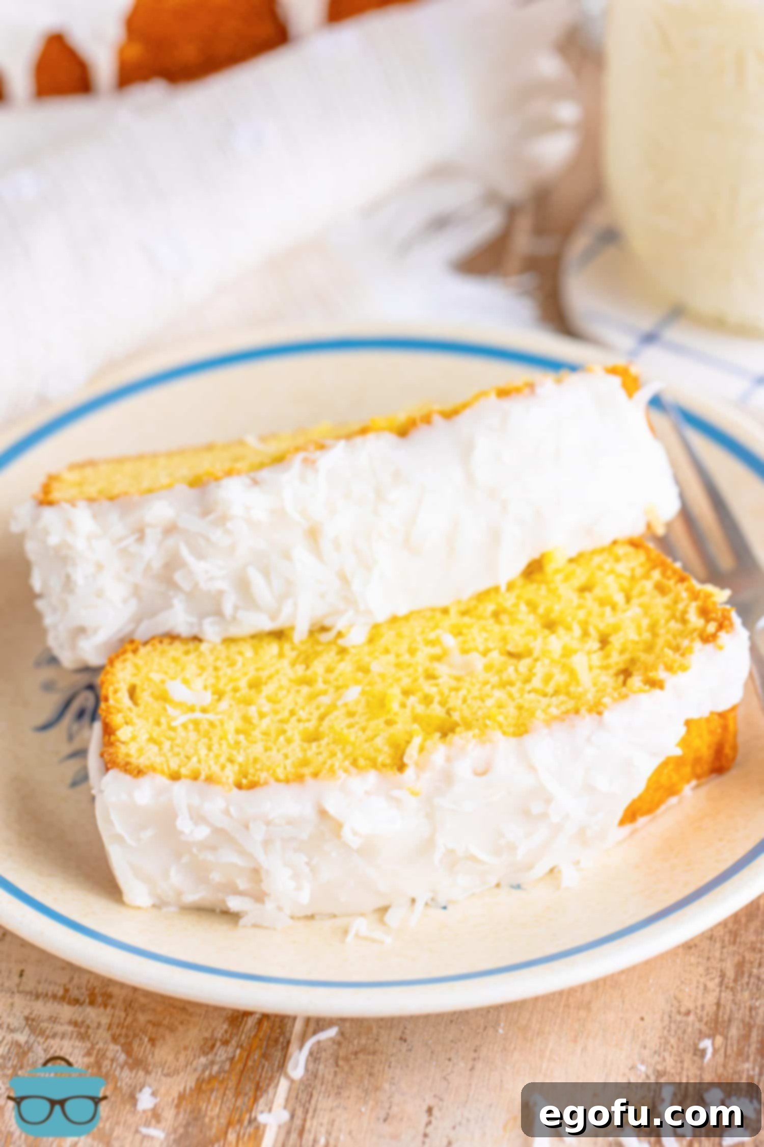 Tropical Coconut Bake 2 Two slices of glazed Coconut Bread on a plate.