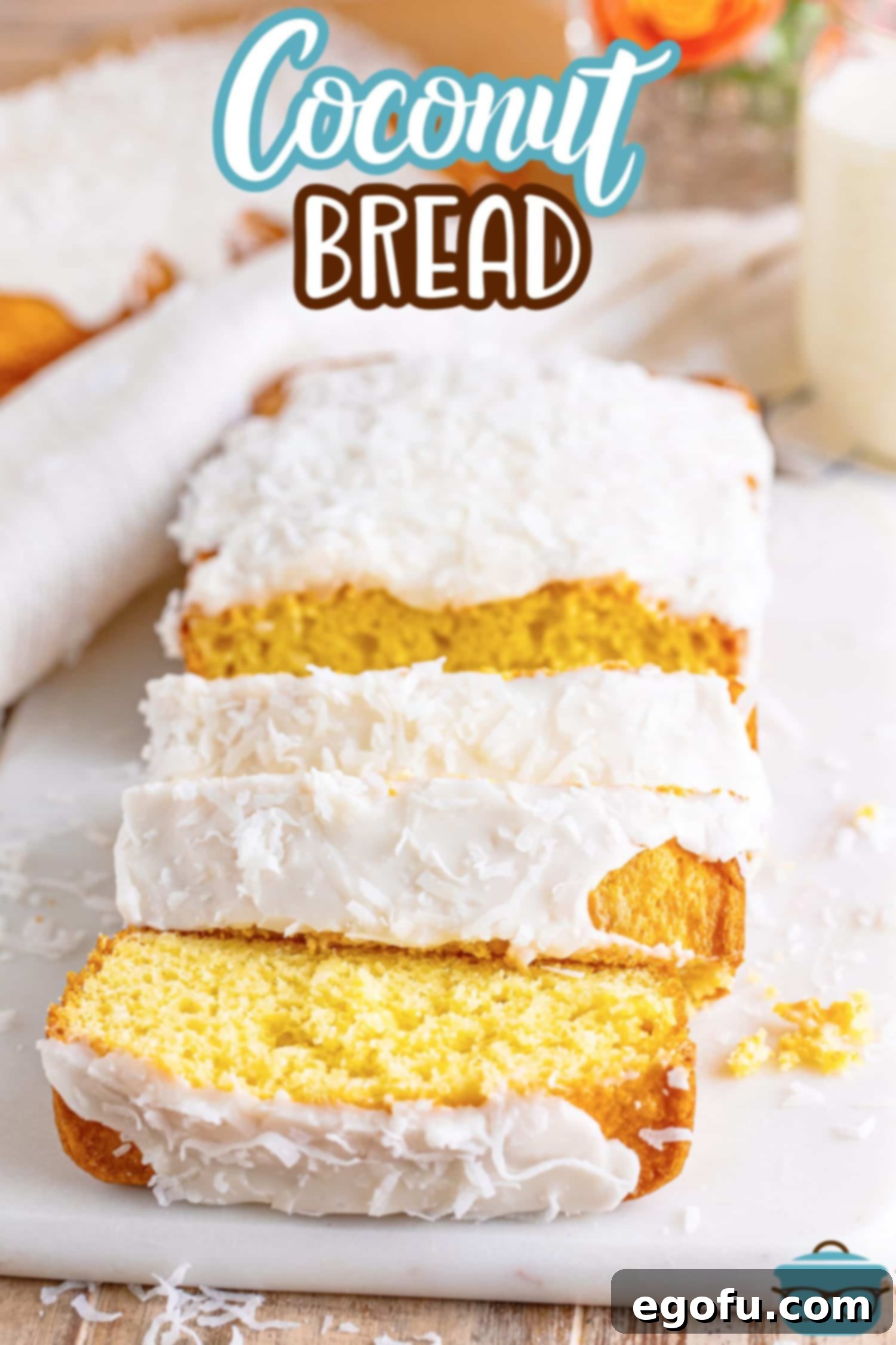 Tropical Coconut Bake 3 A loaf of Coconut Bread with a few slices in the front cut off.