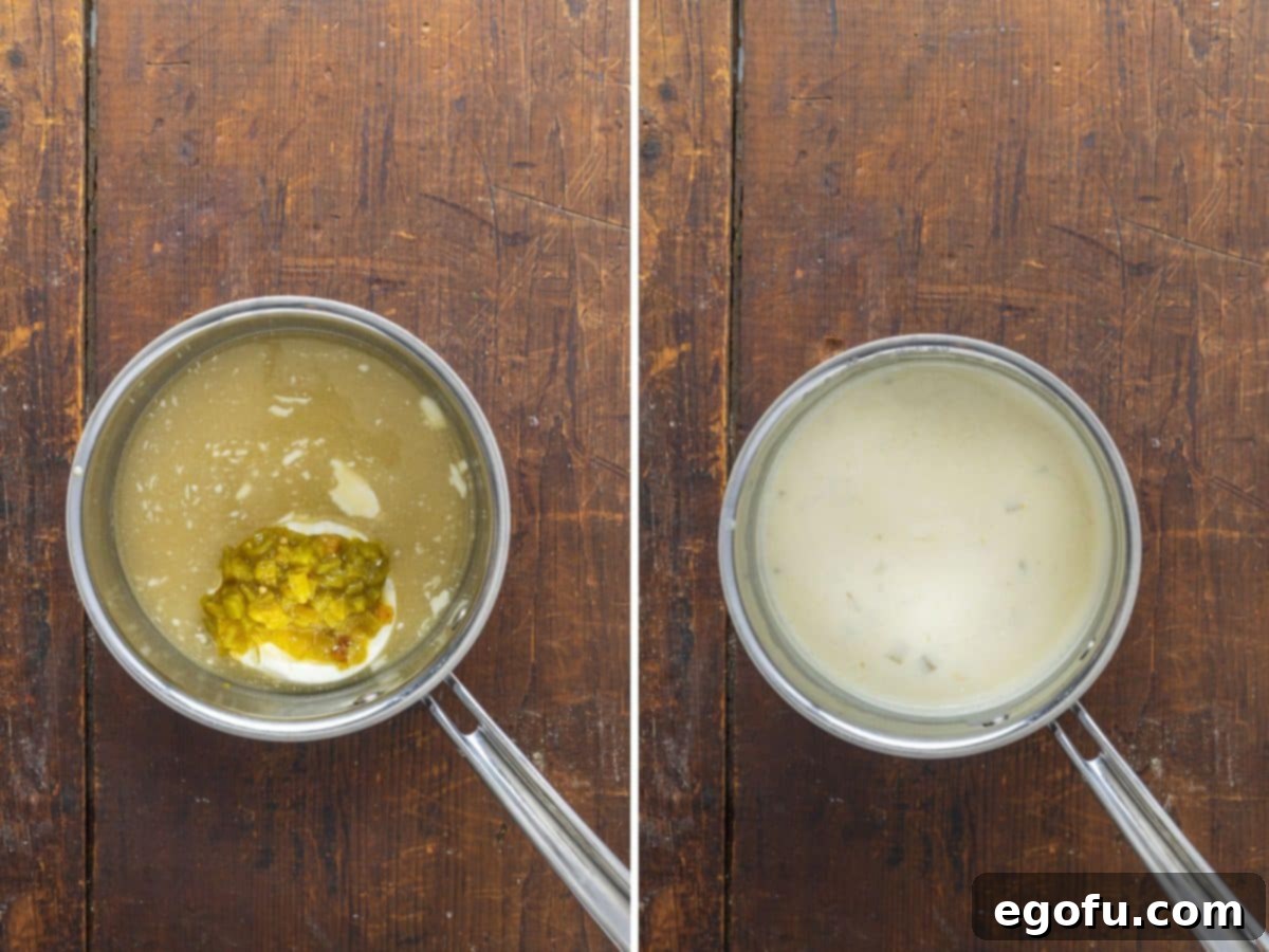 Creamy chicken enchilada sauce simmering in a saucepan, showcasing its smooth texture.