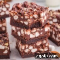 Rocky Road Bliss Bars 12 A small stack of Rocky Road Brownies, showcasing the texture and topping.