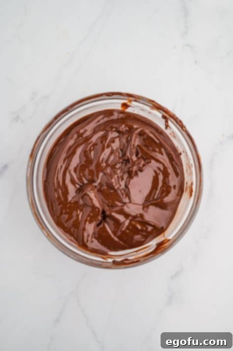 Rocky Road Bliss Bars 18 Chocolate topping mixture in a bowl.