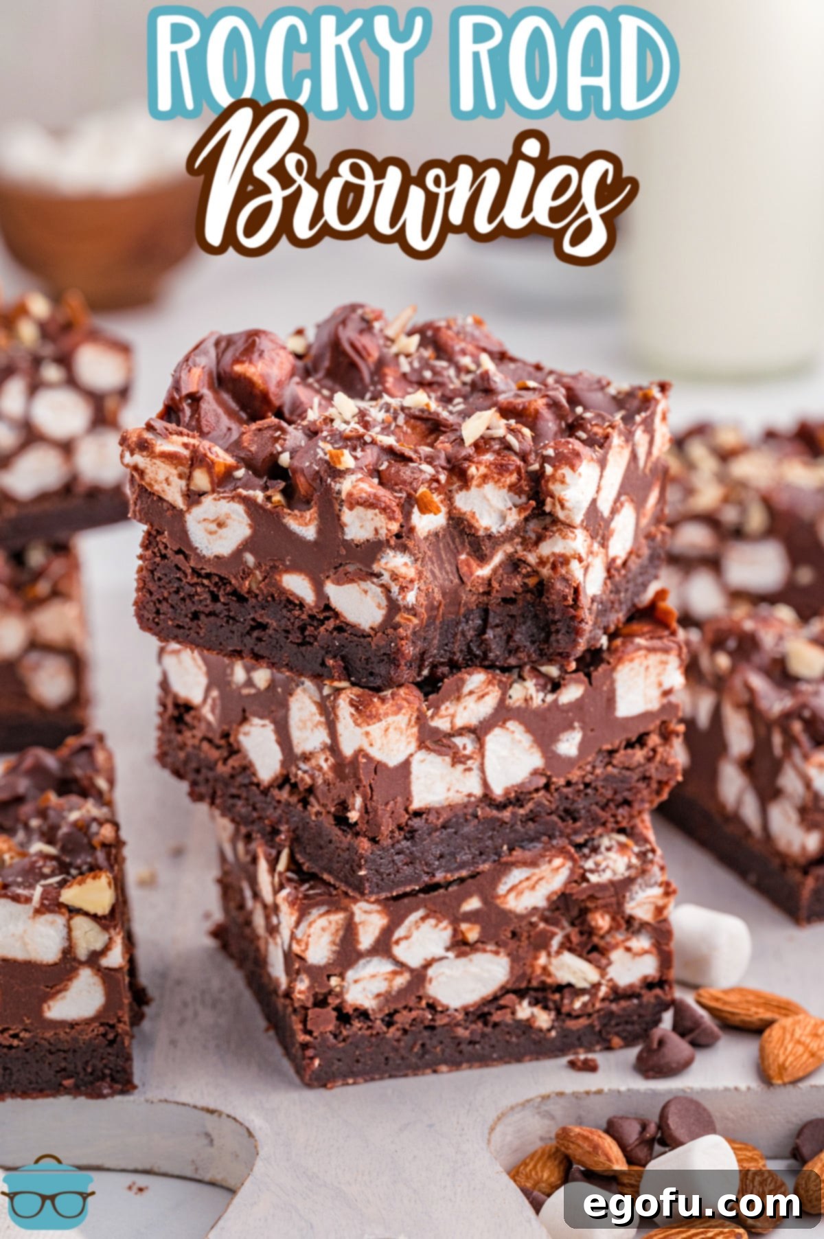 Rocky Road Bliss Bars 3 A small stack of Rocky Road Brownies with a few other ones around, showcasing the texture.