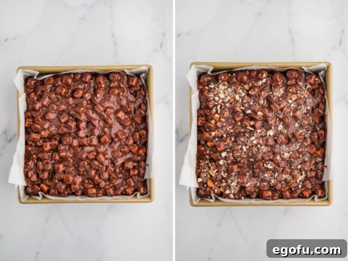 Rocky Road Bliss Bars 10 Chocolate peanut butter marshmallow mixture spread on top of brownies with extra nuts added.