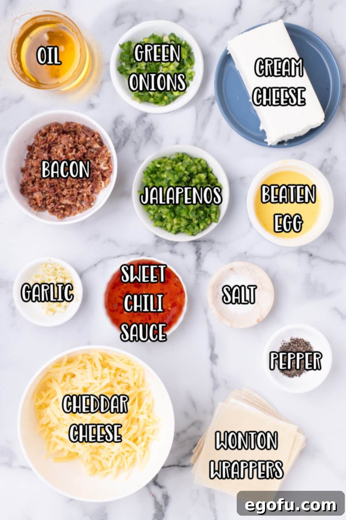 Crispy Jalapeño Wonton Poppers 4 Wonton wrappers, cream cheese, jalapenos, green onions, garlic cloves, salt, pepper, cheddar cheese, bacon, egg, and water.