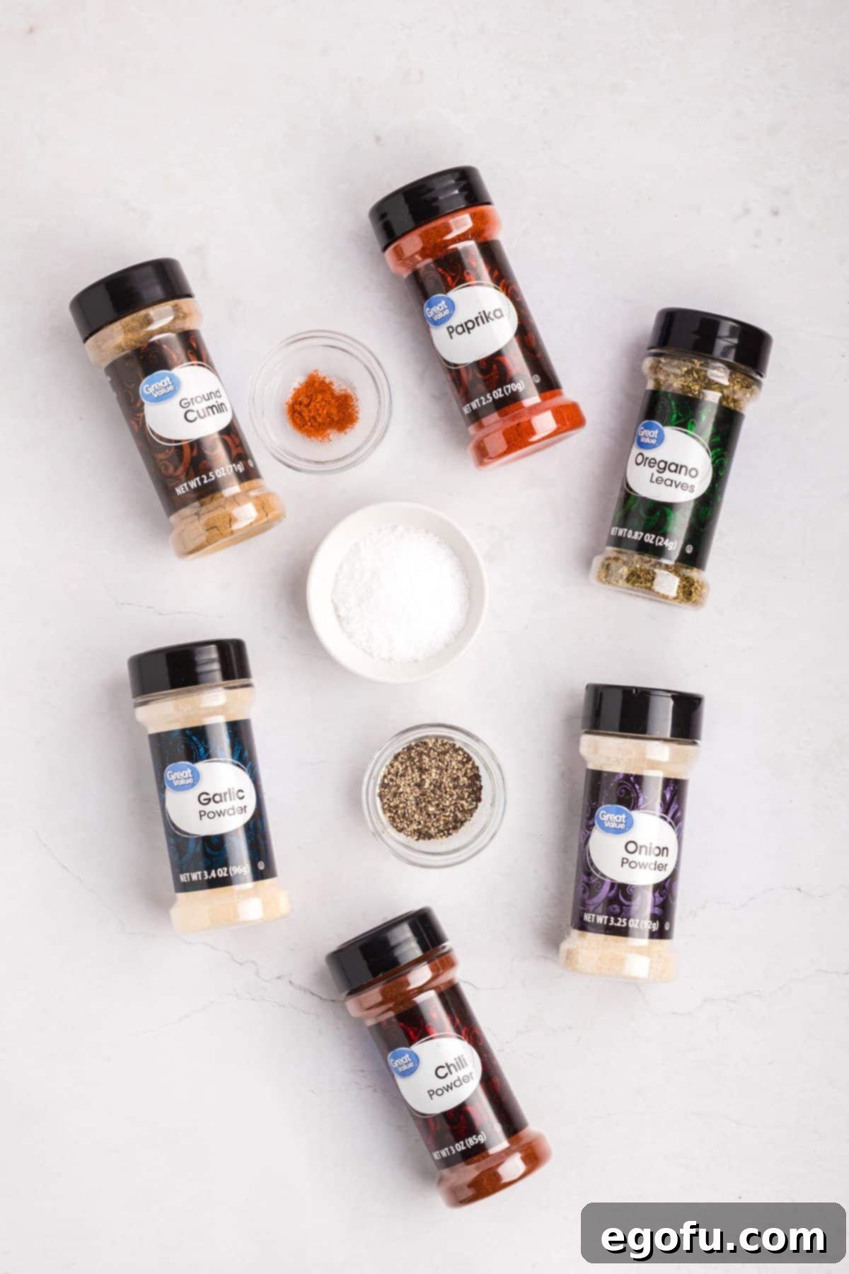 Chili powder, cumin, paprika, kosher salt, pepper, garlic powder, onion powder, oregano, and cayenne pepper.