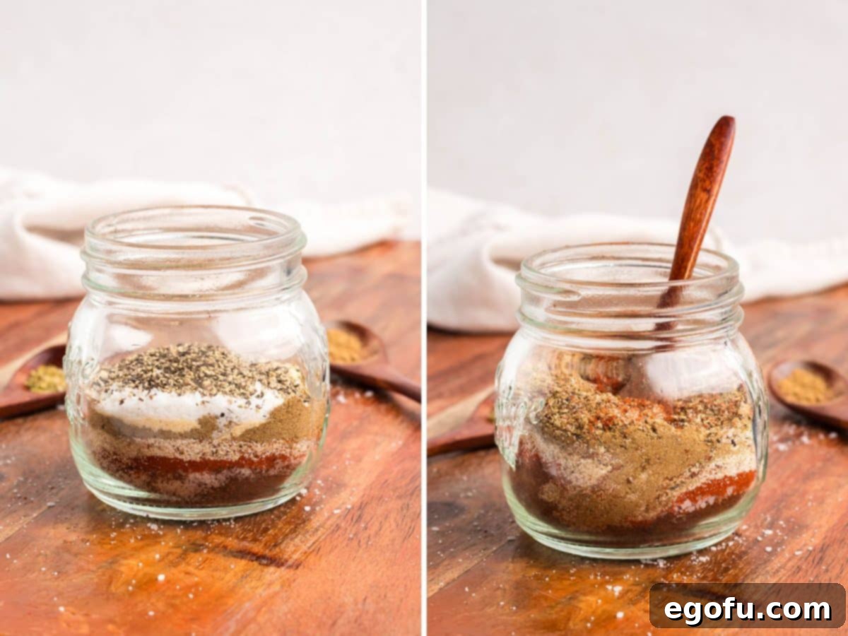 A blend of Fajita Seasonings in a jar with a wooden spoon stirring it all up.