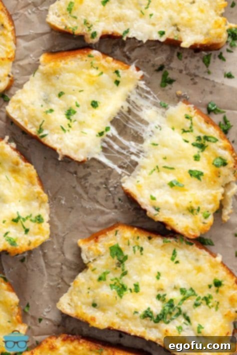 A few slices, one pulled apart of Pizza Hut Garlic Cheese Bread.