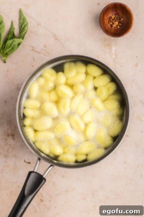 Gnocchi boiling in a pot.