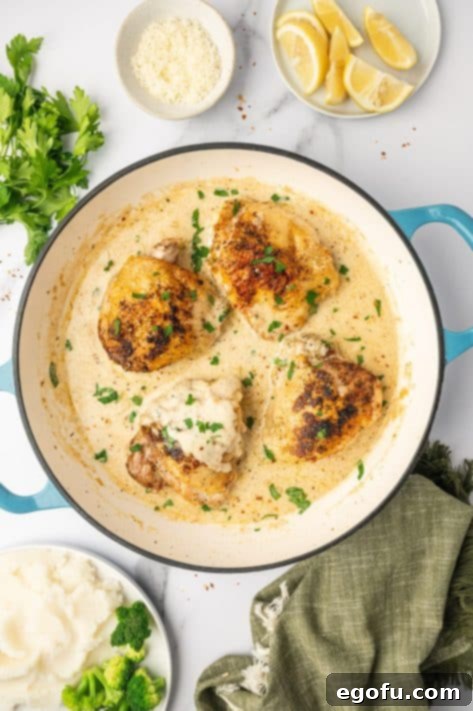 Creamy Garlic Chicken Delight 9 The finished Creamy Garlic Chicken dish, garnished with vibrant green parsley, ready to be enjoyed.