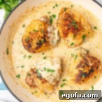 Creamy Garlic Chicken Delight 11 Looking down on a skillet of Creamy Garlic Chicken, showcasing the rich sauce and perfectly cooked chicken.