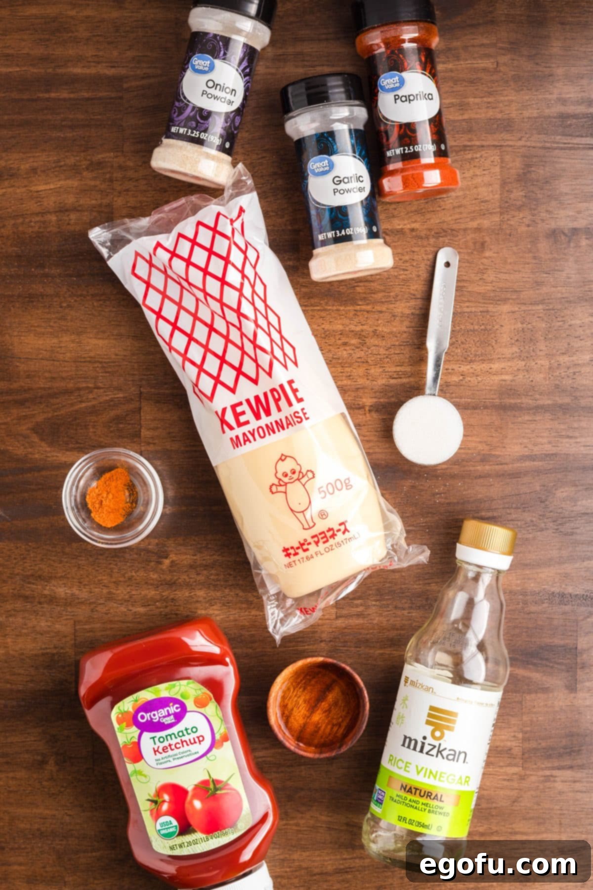 Mayo, ketchup, water, rice vinegar, sugar, paprika, garlic powder, onion powder, and cayenne pepper.