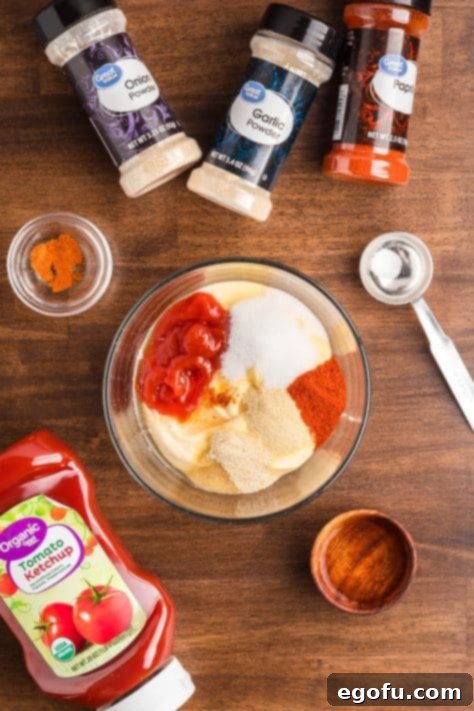 All ingredients needed to make homemade Yum Yum Sauce in a bowl waiting to be mixed.