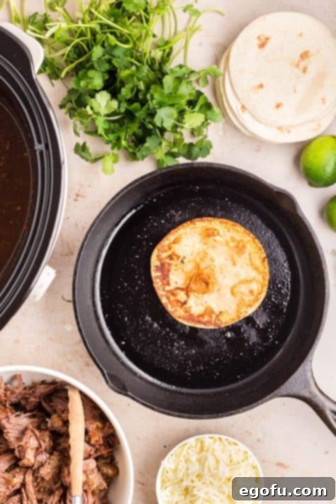 A shell cooking in a cast iron pan.