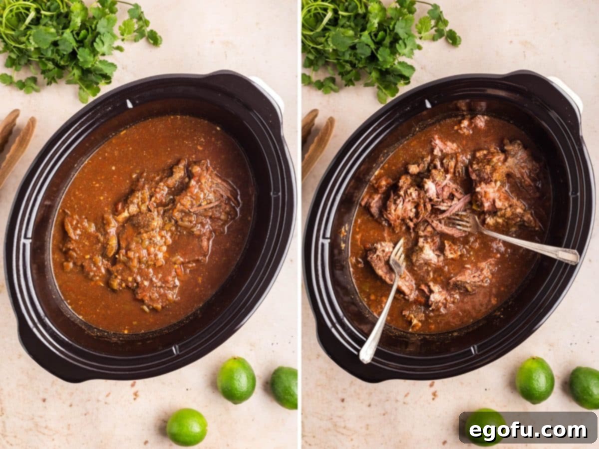 A cooked Chuck roast in a Slow a cooker and two forks shredding the roast. 