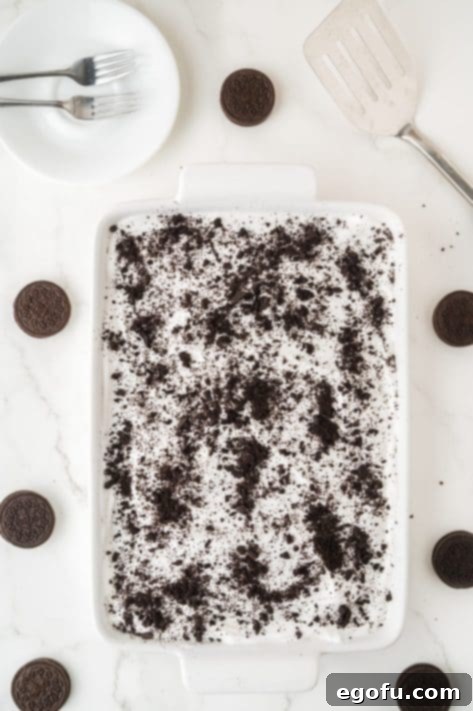 Crushed Oreos over the layered Oreo dessert.