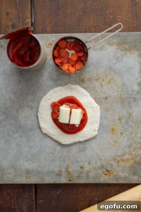 Biscuit dough, pizza sauce, string cheese, and mini pepperonis.