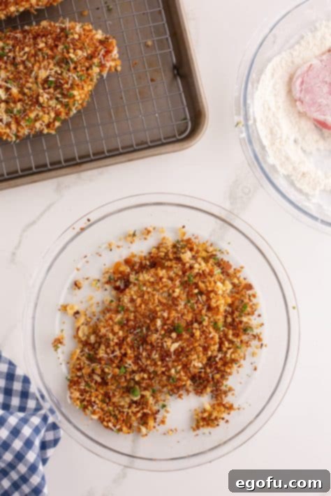 pork chop coated in toasted breadcrumb mixture.