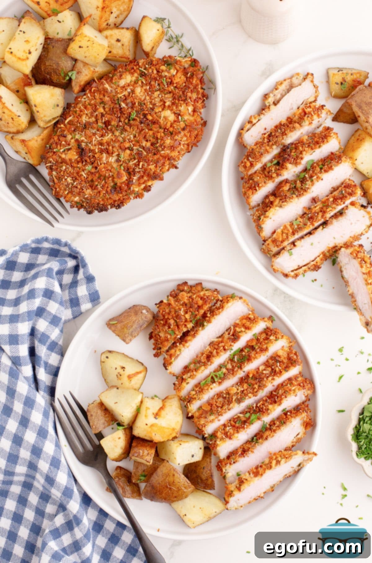 sliced pork chops on a white round plate.