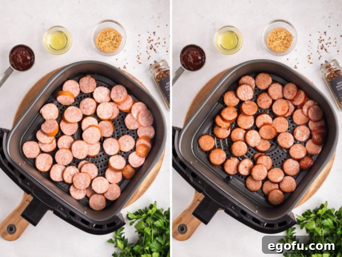 Sweet and Sticky Air Fryer Kielbasa 6 An Air Fryer basket with slices of Kielbasa covered in olive oil