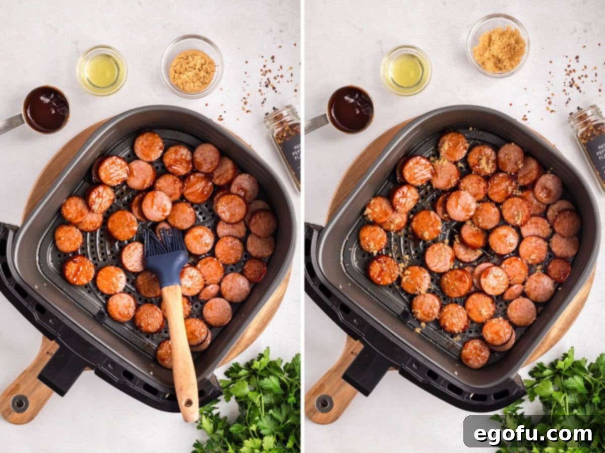 Sweet and Sticky Air Fryer Kielbasa 7 BBQ sauce being brushed on slices of kielbasa.