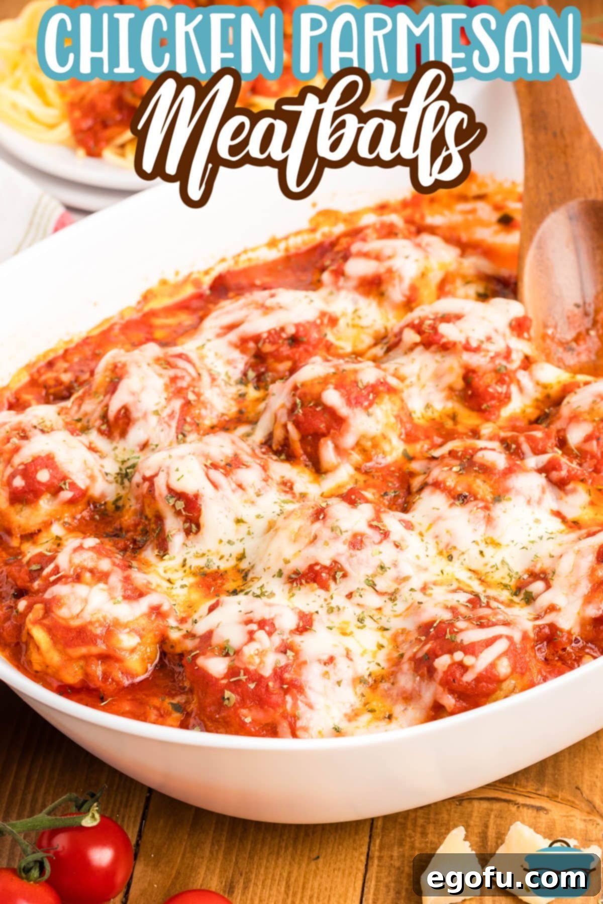 Chicken Parm Meatball Bake 4 A large serving bowl filled to the brim with hot, cheesy Chicken Parmesan Meatballs, ready to be served.