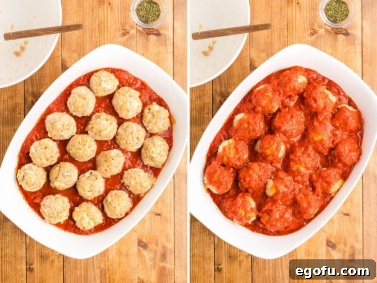 Chicken Parm Meatball Bake 8 Partially baked meatballs in the marinara sauce, ready for the second layer of sauce and cheese.