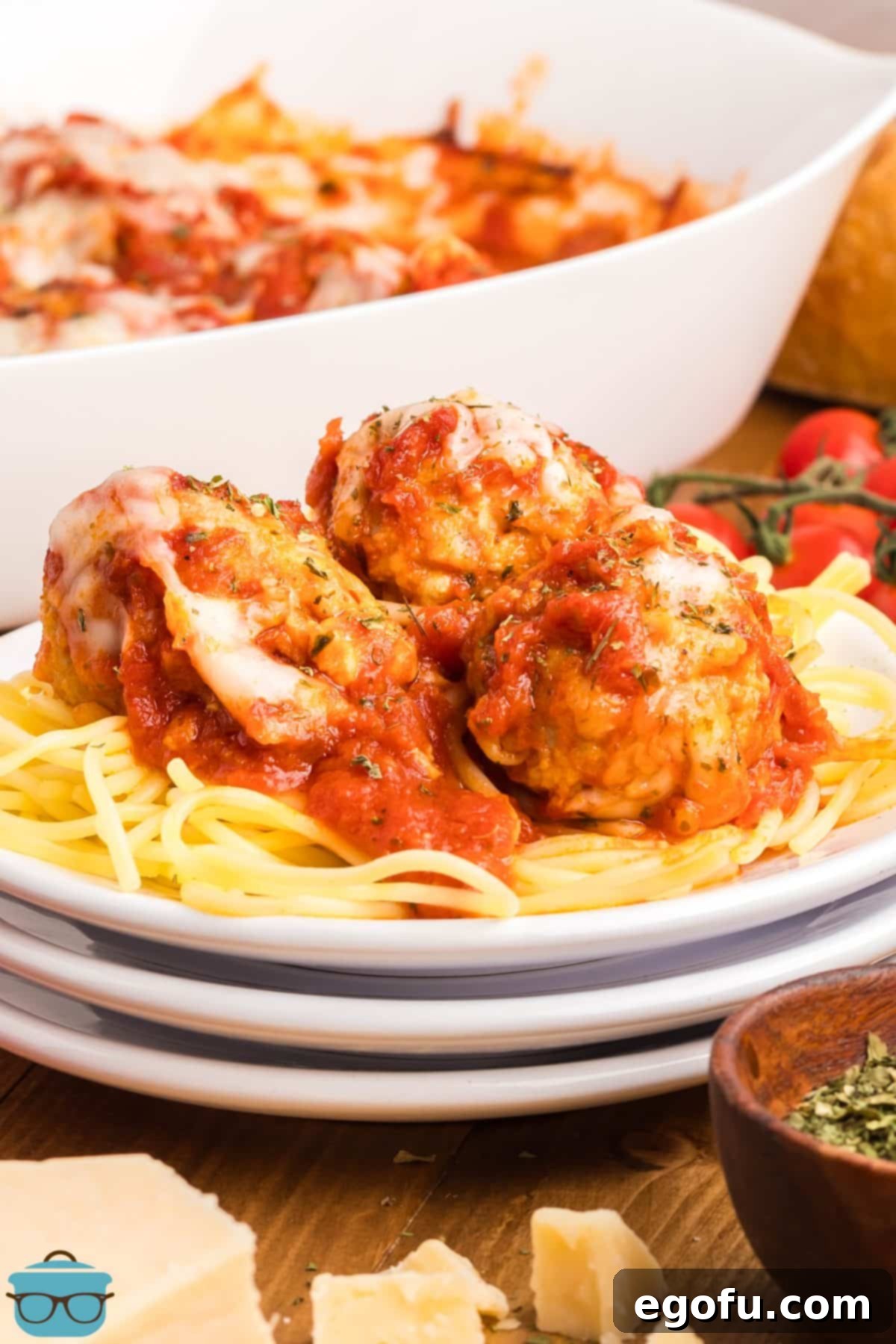 Chicken Parm Meatball Bake 10 A plate of perfectly cooked spaghetti topped generously with hot, cheesy Chicken Parm Meatballs.
