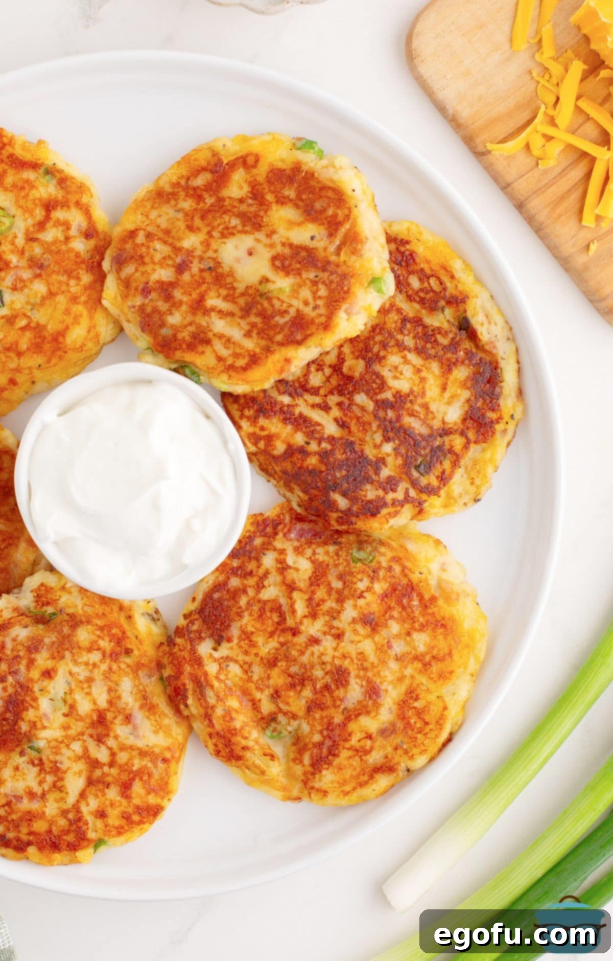 Crispy Potato Fritters 2 Looking down on a ring of Potato Cakes on a plate.