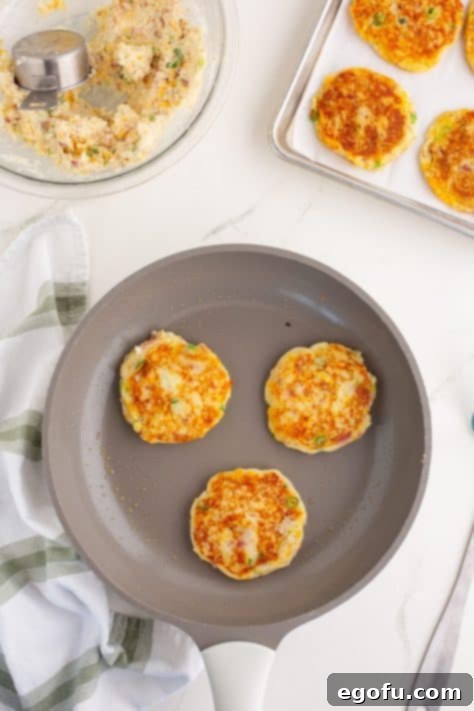 Crispy Potato Fritters 11 Potato Cakes frying in a pan.