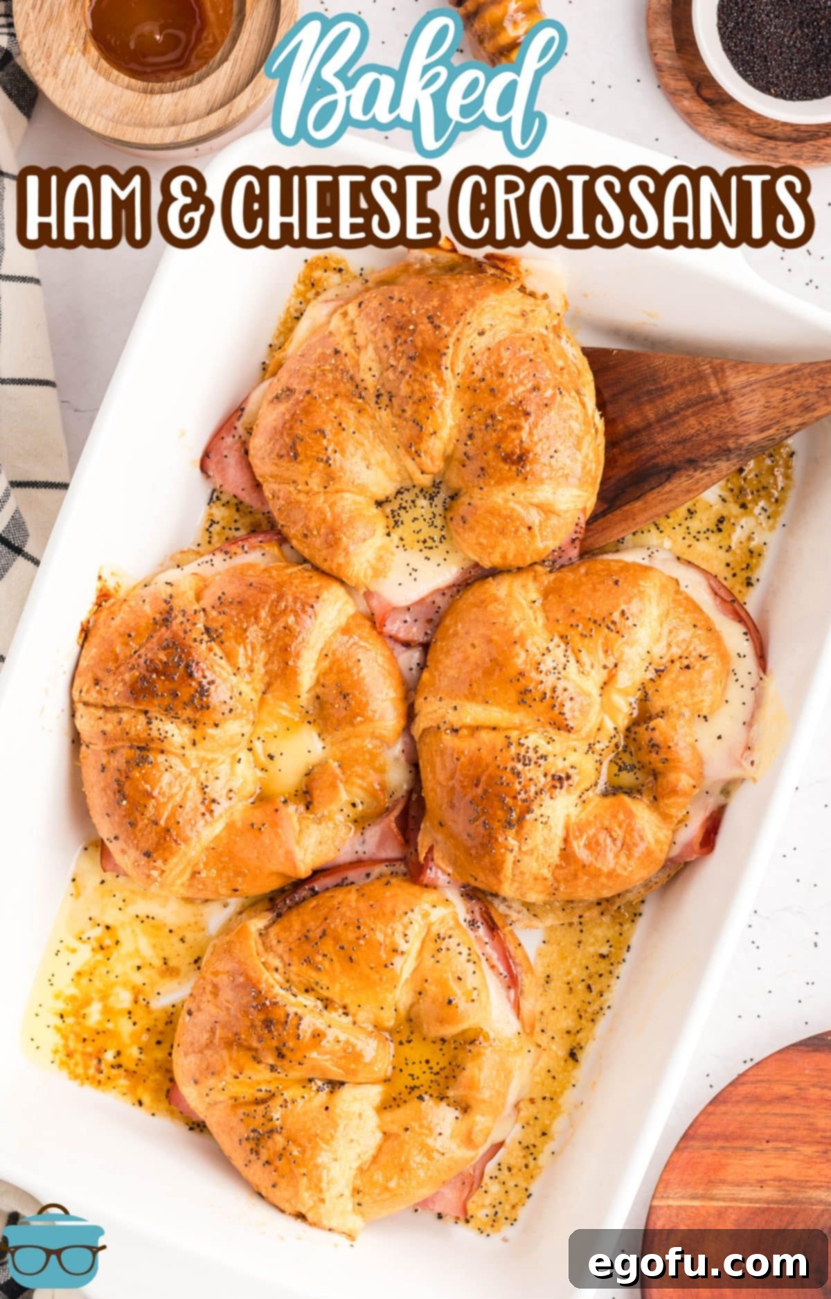 A baking dish filled with Baked Ham and Cheese Croissants.
