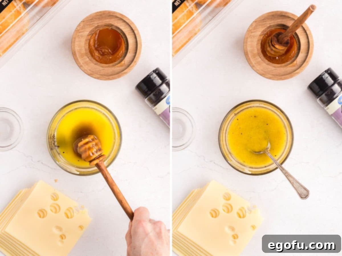 Honey being added to a sauce and a spoon mixing it.