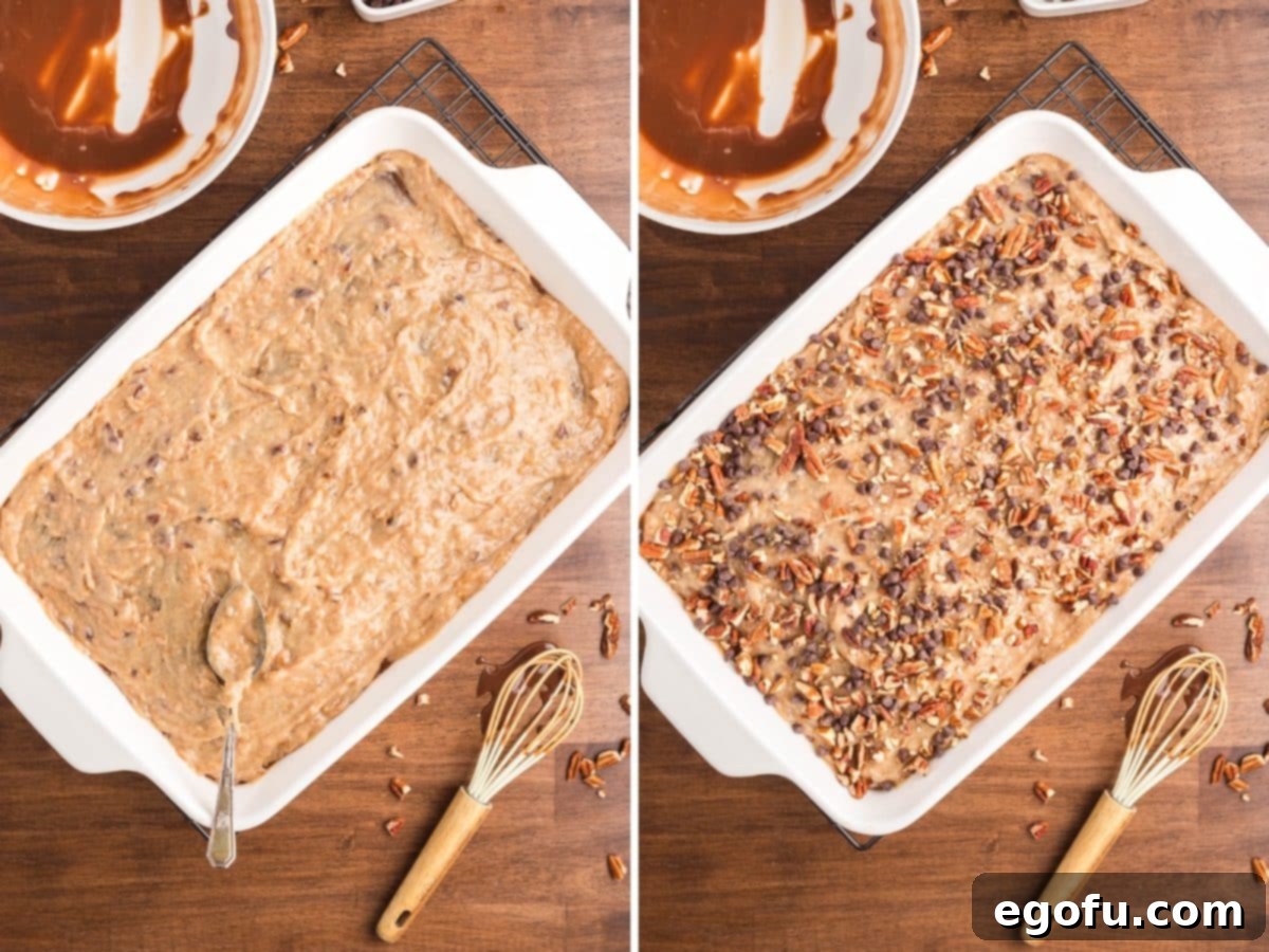 A German Chocolate Poke Cake generously covered with coconut pecan frosting, ready for serving.