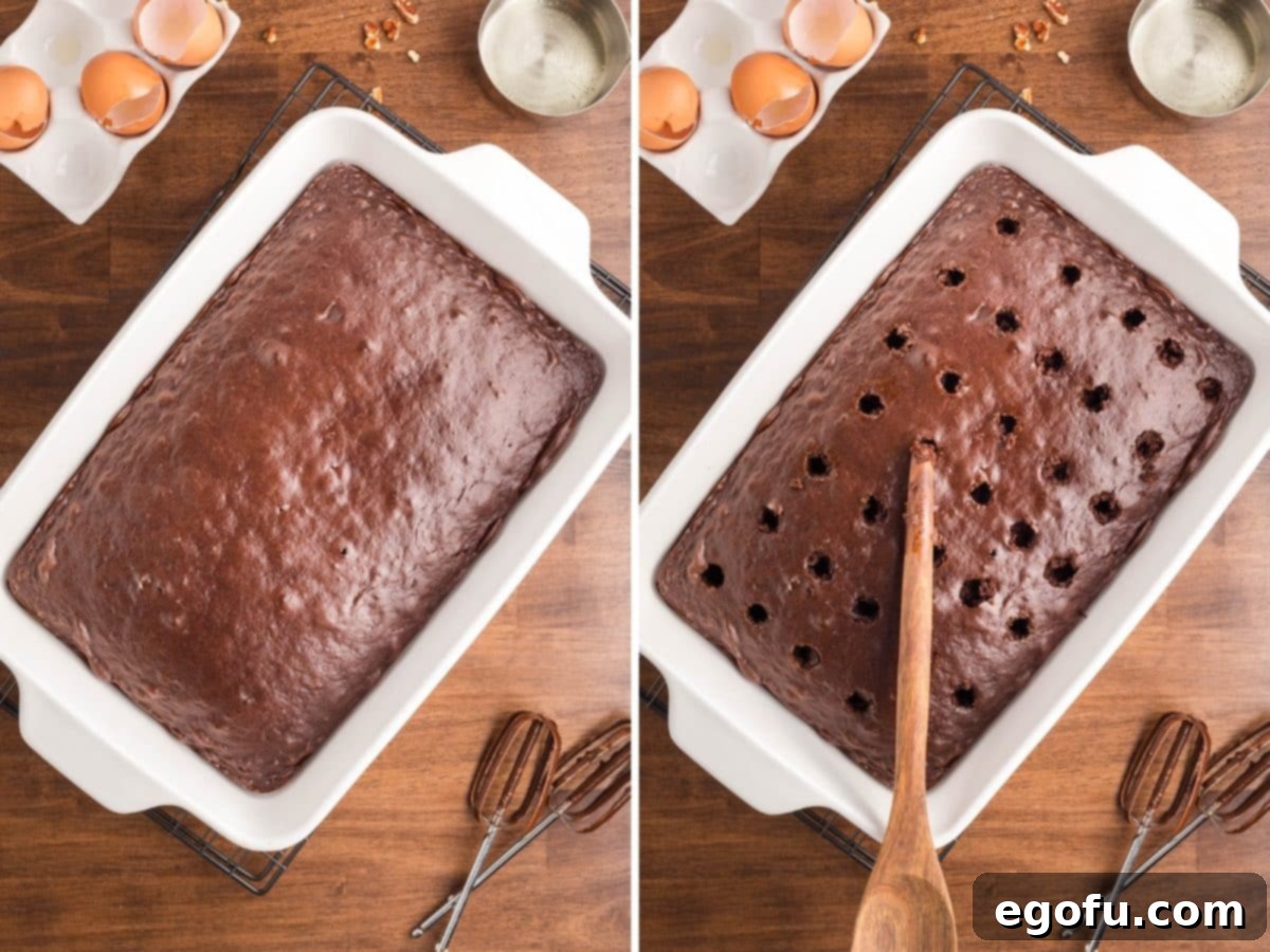 A freshly baked chocolate cake in a baking dish, and a wooden spoon being used to poke holes into the cooled cake.