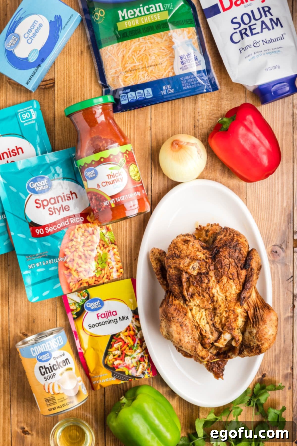 Some green bell pepper, red bell pepper, yellow onion, avocado oil, cream of chicken soup, salsa, cream cheese, Mexican shredded cheese, sour cream, fajita seasoning, rotisserie chicken, Spanish style rice, chopped cilantro.