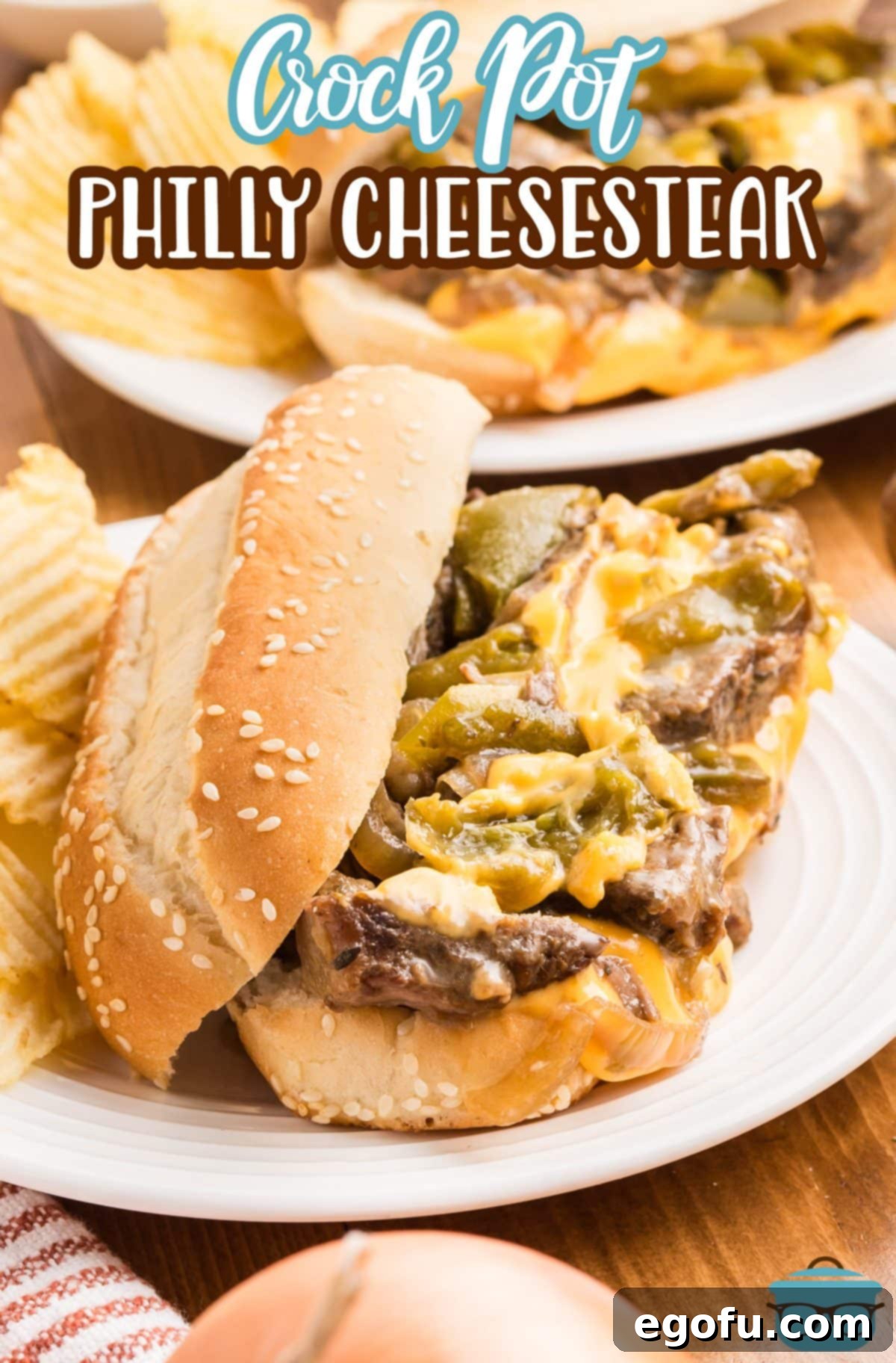 A dinner plate with an open Crock Pot Philly Cheesesteak.