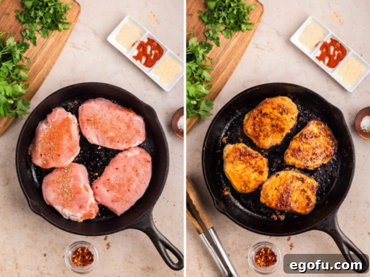 Seasoned pork chops cooking in a cast iron skillet, showing the beautiful sear.