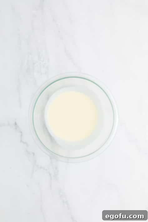 A bowl of heavy cream, ready for heating.