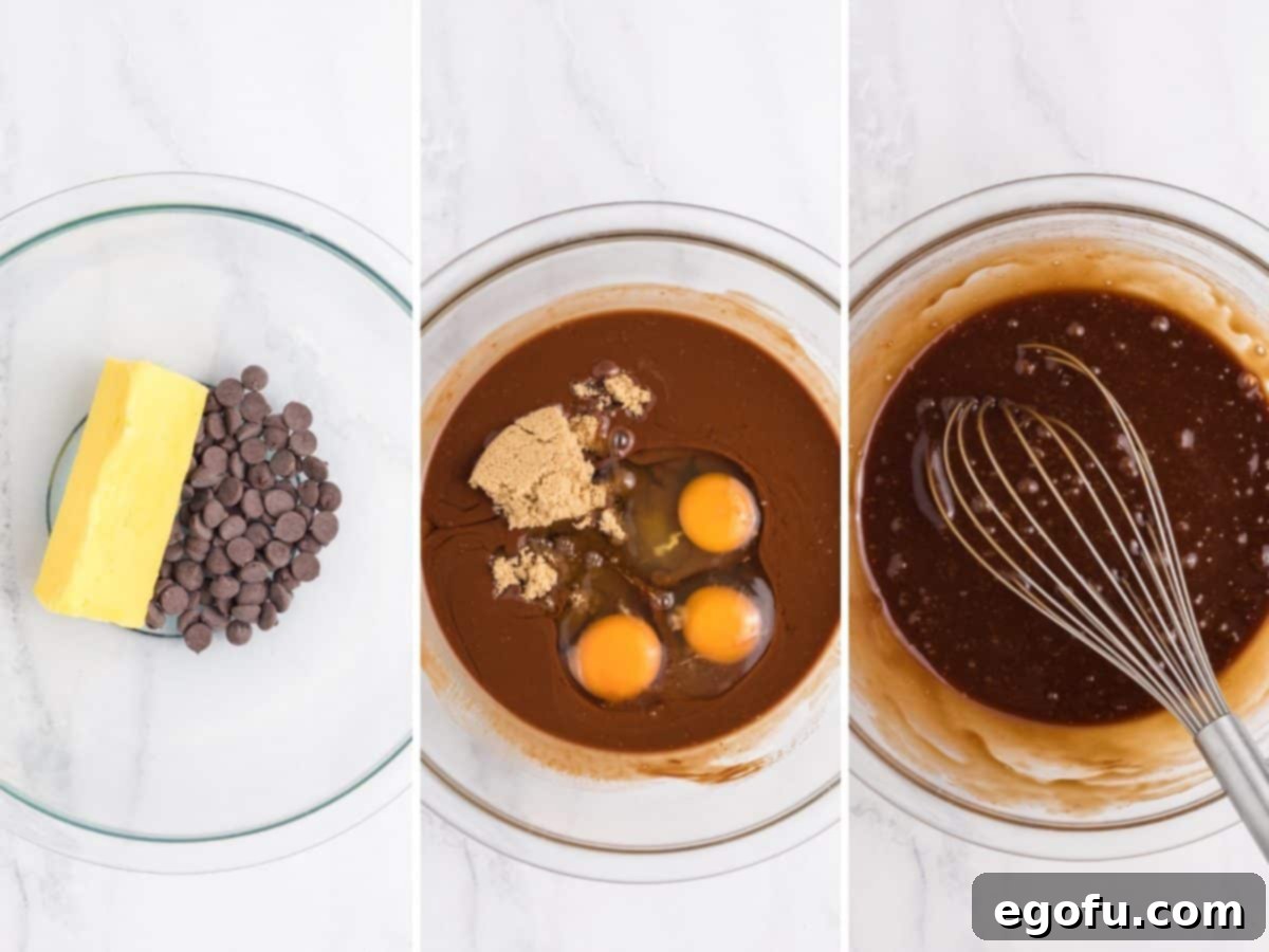 Cosmic brownie batter being mixed in a bowl, showcasing its rich brown color.