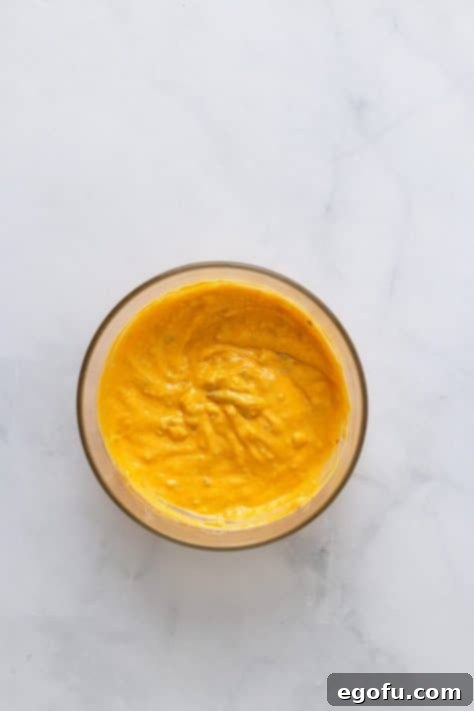 MacSmash Taco 11 Homemade Big Mac sauce being mixed in a bowl.