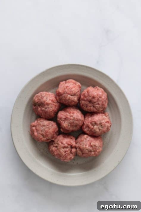 MacSmash Taco 12 Eight ground beef balls on a plate, ready for smashing.